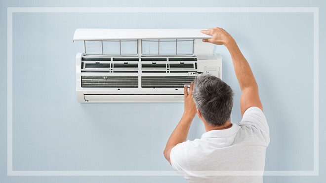 man installing airconditioner